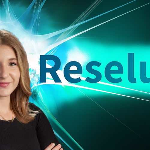 Headshot of Cambre Kelly toward the left of the image wearing a black shirt and smiling at the camera. To the right is the Reselute logotype of thicker sans serif lettering in gradient color from darker to lighter teal left to right. Background is an abstract burst of light colored lines in green and blue hues that highlight behind Kelly’s head and the Reselute logotype.